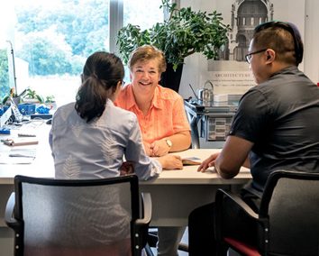 A group of people having a discussion during office hours.