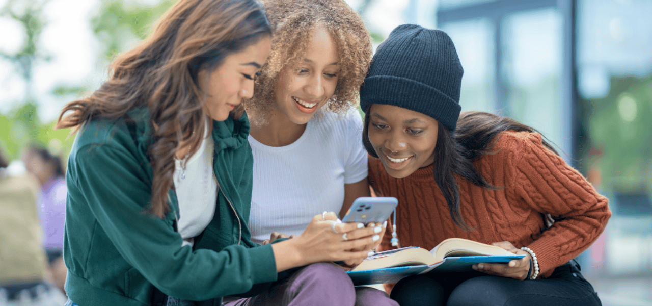 A group of people using social media on a mobile phone